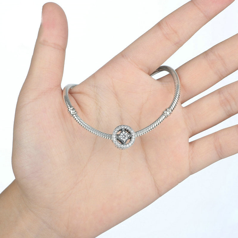 Perla di fascino rotonda cava in argento sterling scintillante